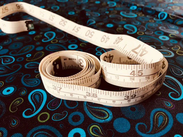 Tape Measure on Paisley Golf Shirt